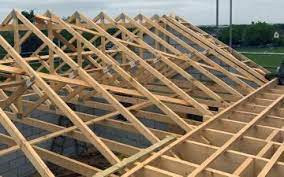 Work in progress on a residential roof with wooden trusses