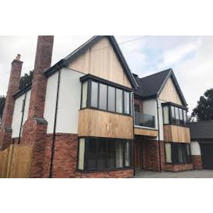 front view of an interconnected house with wide windows